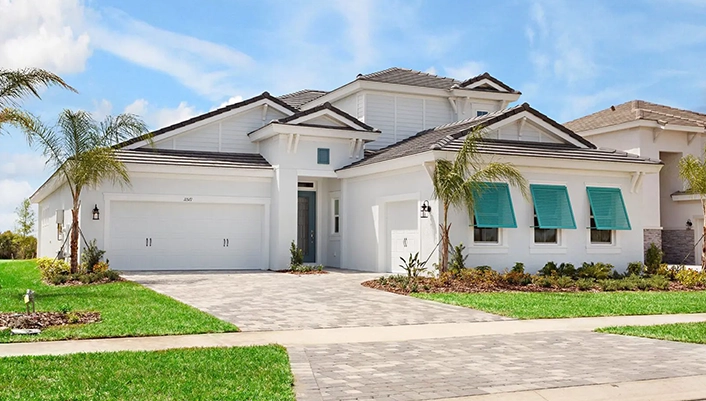 Modern white suburban house with turquoise awnings