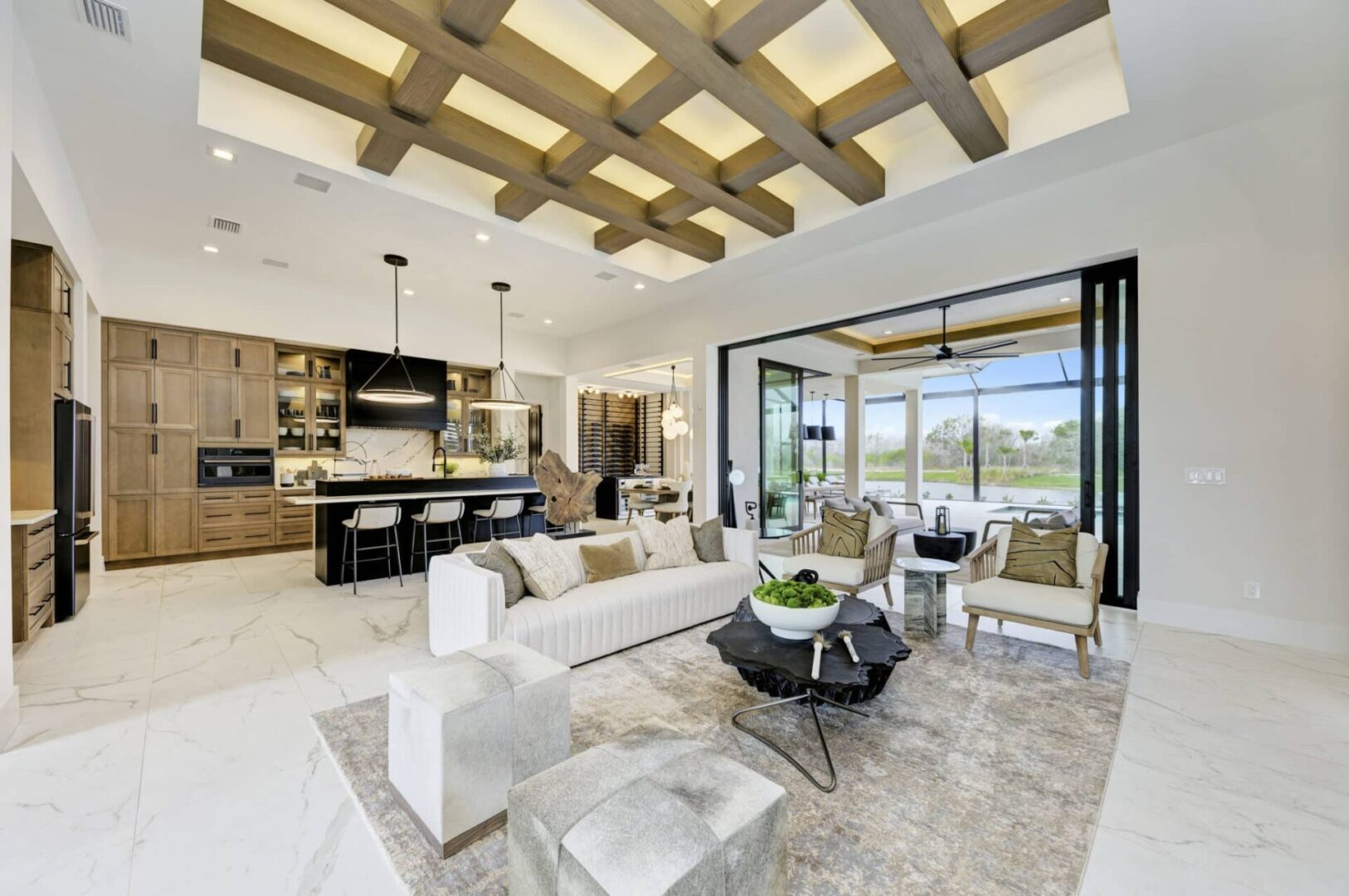 Luxury open-concept living room with pool view